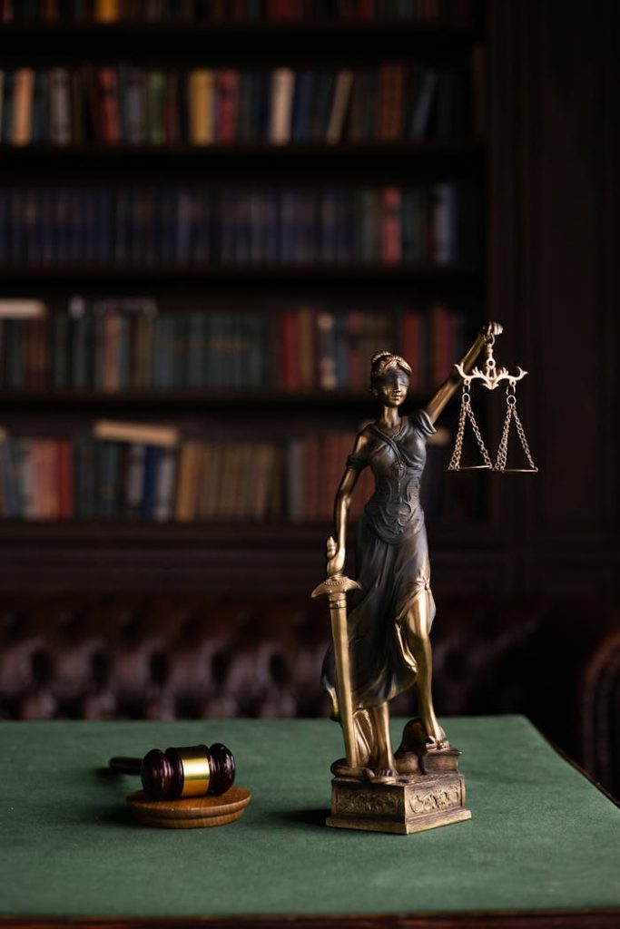 The Art of Drawing Readers In: Your attractive post title goes here Lady Justice and gavel on a table in a classic law library setting.